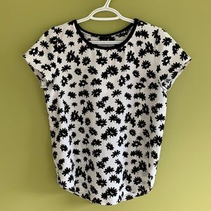 Ann Taylor creamy white and black flower printed top. Polyester.